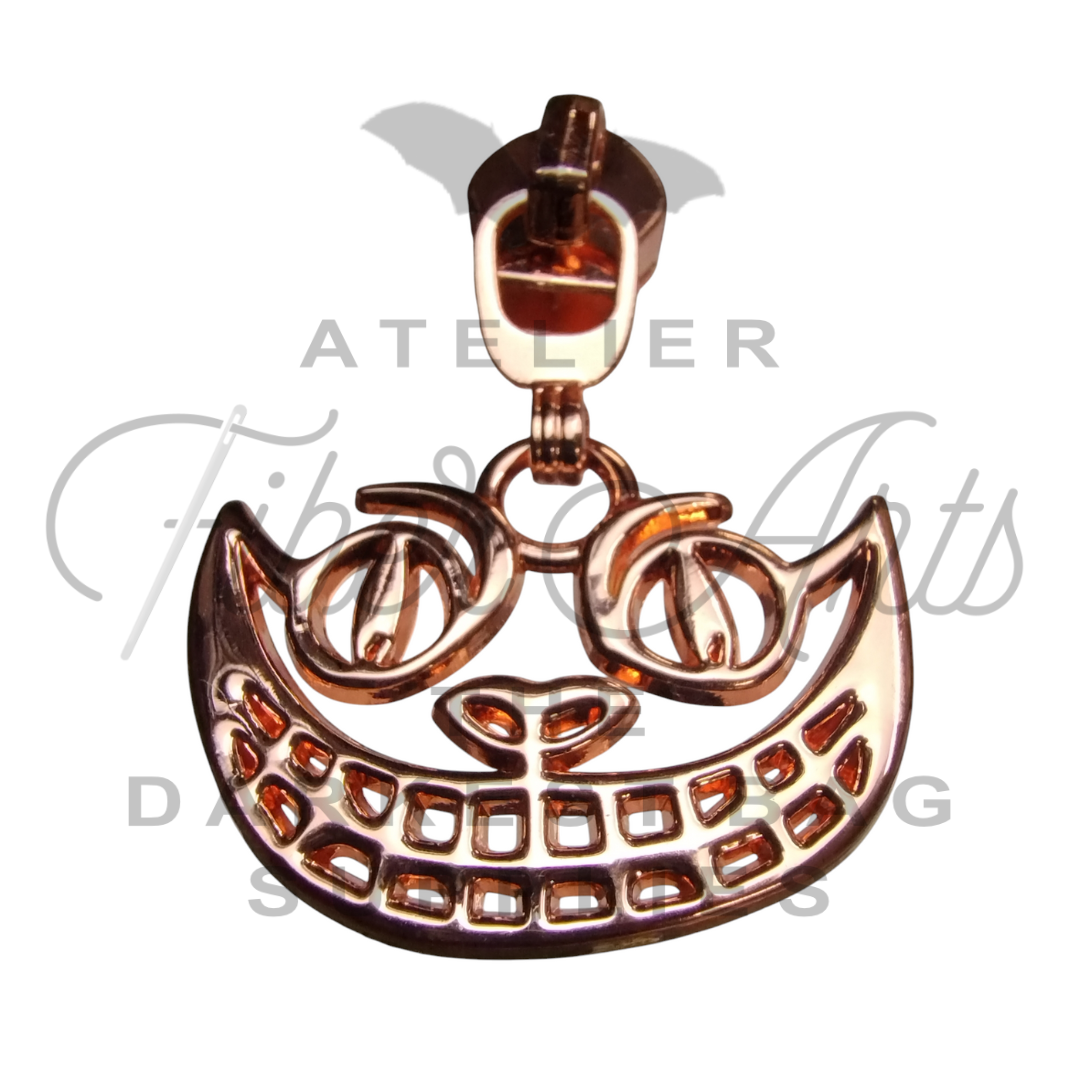 #5 Cheshire Grin Zipper Pulls in Various Finishes - 3pcs at Atelier Fiber Arts